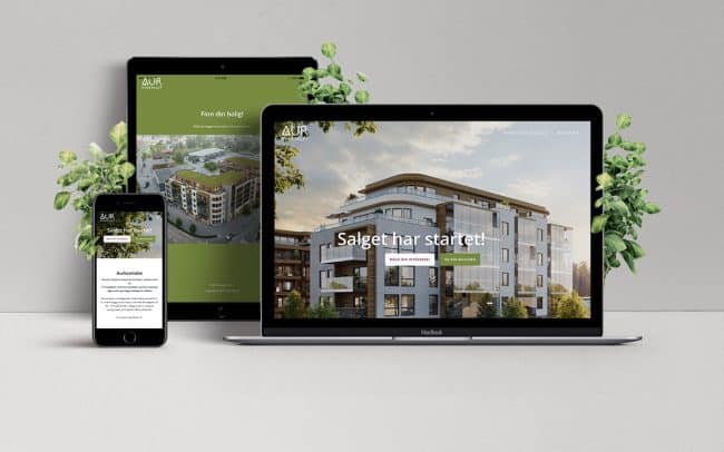 Mockup av websider for Aurkvartalet, vist på desktop, nettbrett og mobil